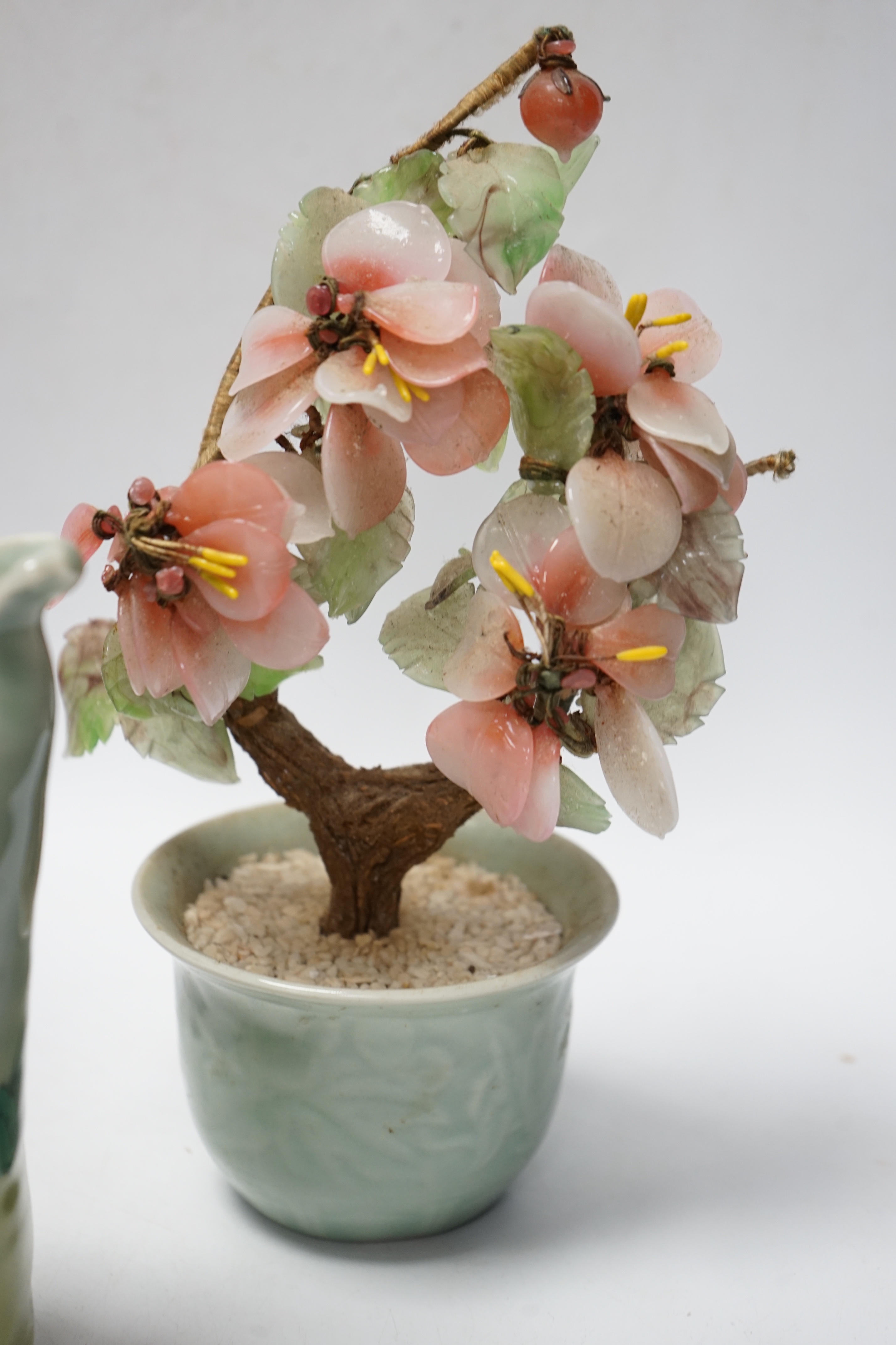 A Chinese flambé vase, famille rose jug, celadon plant pot and a Japanese porcelain figure, tallest 23cm